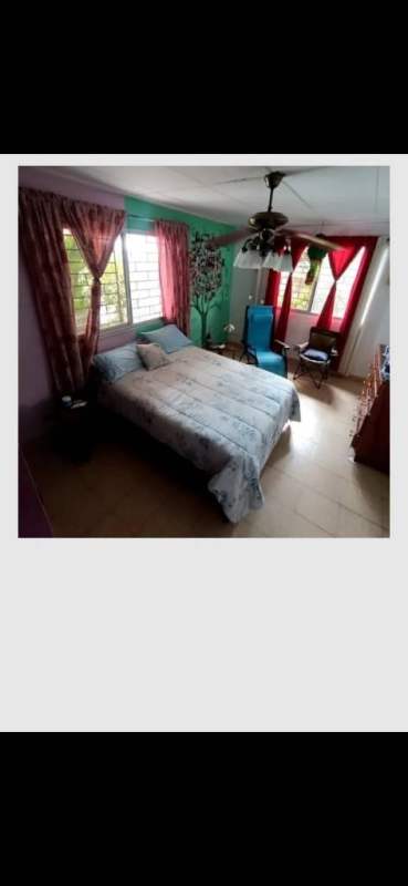 Bathroom featuring glass shower, mural walls, tile, Paraíso San Miguelito house