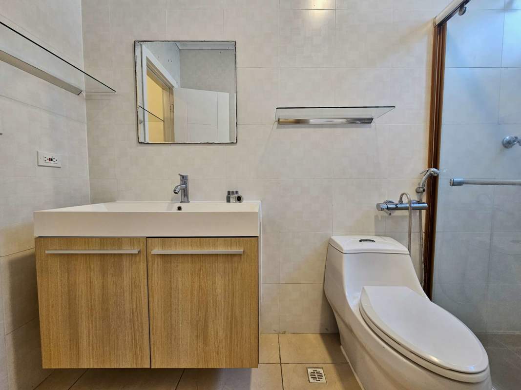 Contemporary bathroom with walk-in shower and marble sink countertop Punta Pacífica