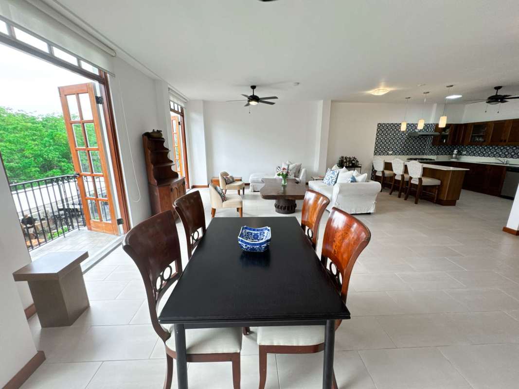 Open concept living dining kitchen space with balcony PH Star & Herald Casco Viejo Panama