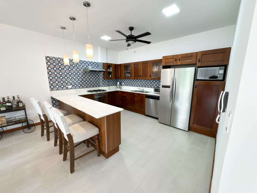 Spacious contemporary kitchen with breakfast bar stainless appliances in PH Star & Herald Casco Viejo