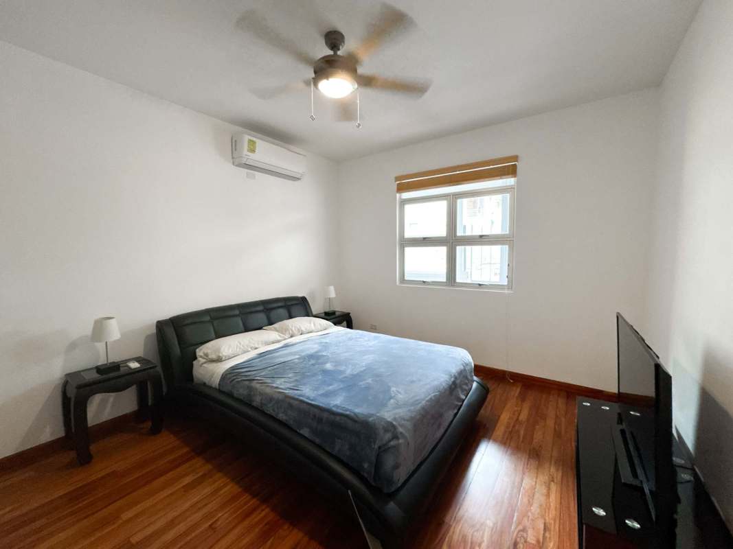 Modern minimalist bedroom with AC ceiling fan wood floor in PH Star & Herald Casco Viejo Panama