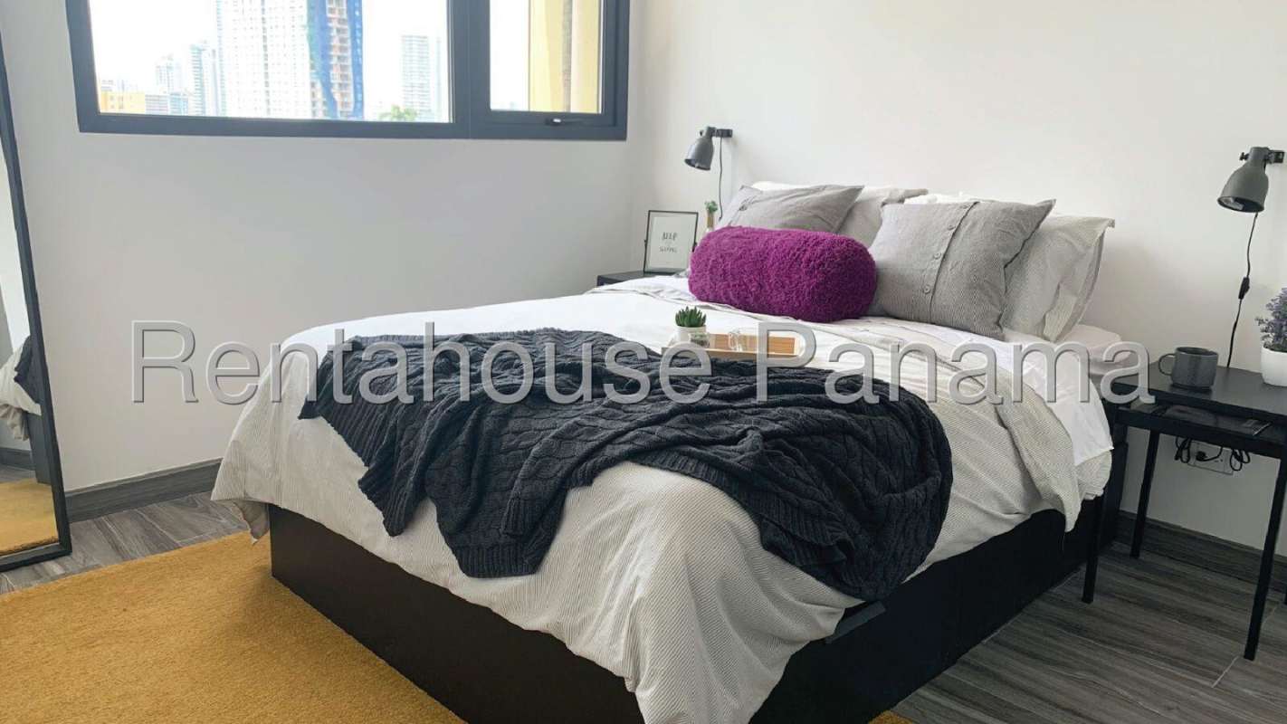 Modern kitchen with granite counters, open layout in PH Mondrian Panama City condo