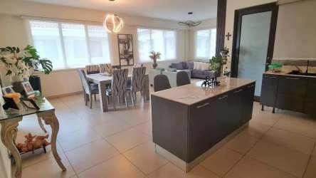 Contemporary open kitchen and dining space with abundant natural light in PH River Valley Panama