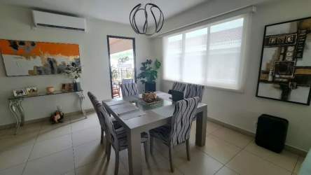 Modern dining room with large windows in River Valley Panama apartment for sale