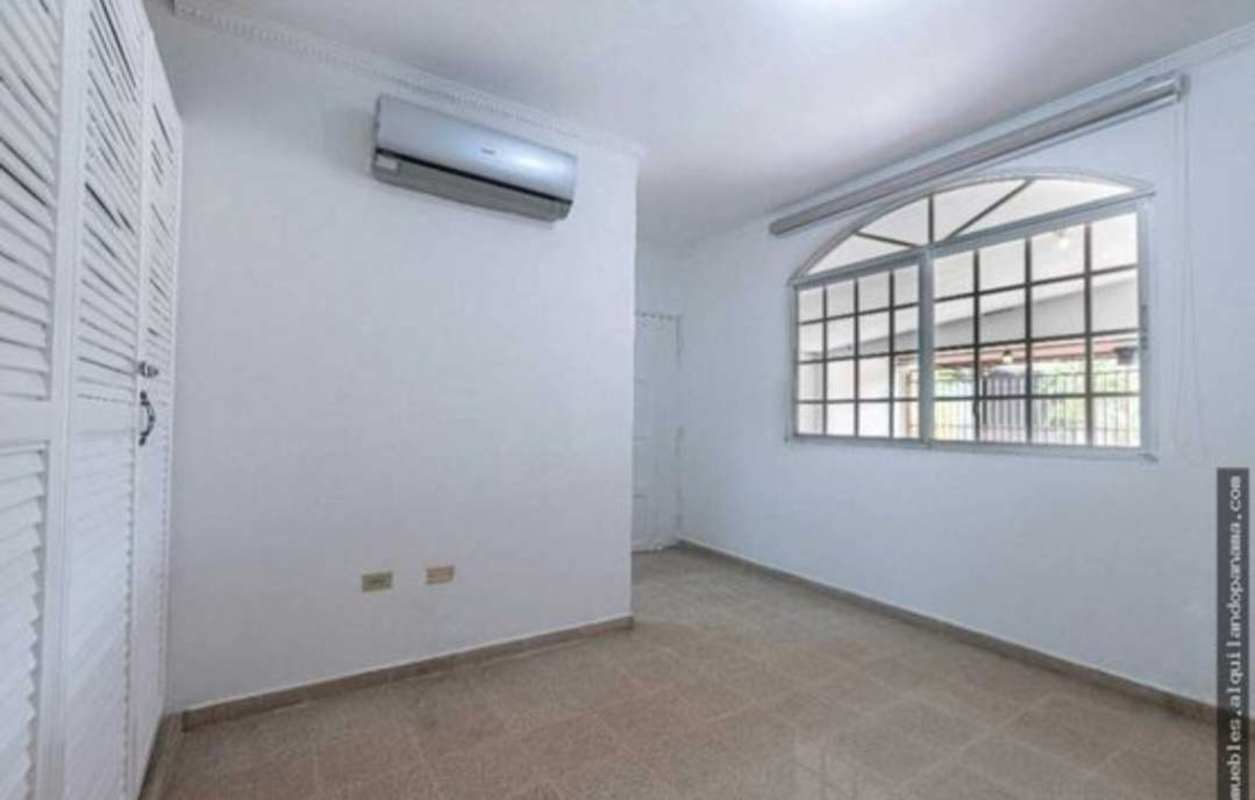 Bedroom with large window split AC closet Monte Oscuro house Panama