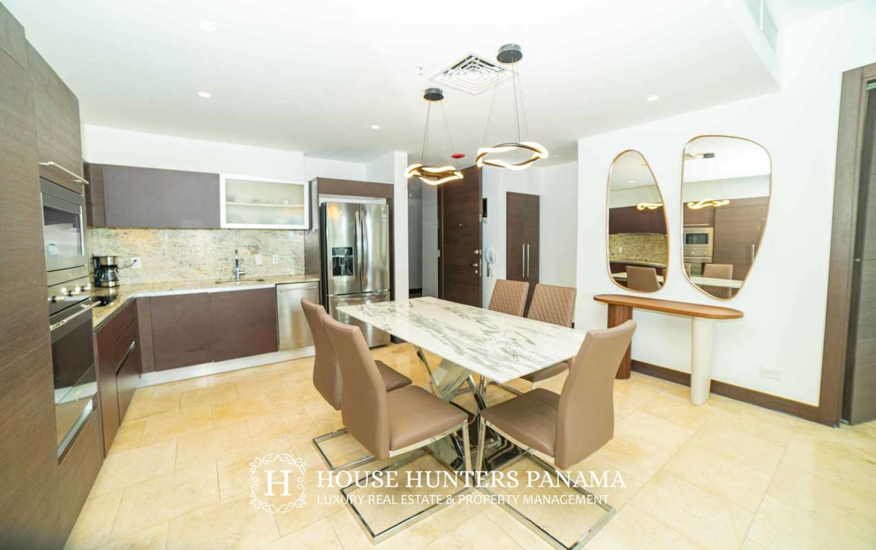 Remodeled kitchen with granite counters and stainless appliances in The Ocean Club Punta Pacifica Panama