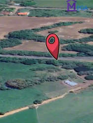 Aerial view showing boundaries of commercial land with marker on main Pedasí highway