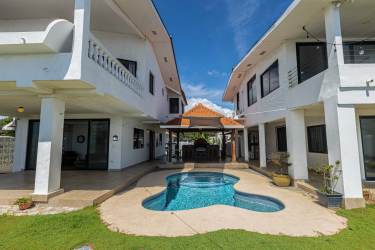 Covered balcony terrace overlooking Malibu Beach and Pacific Ocean from Panama beachfront property