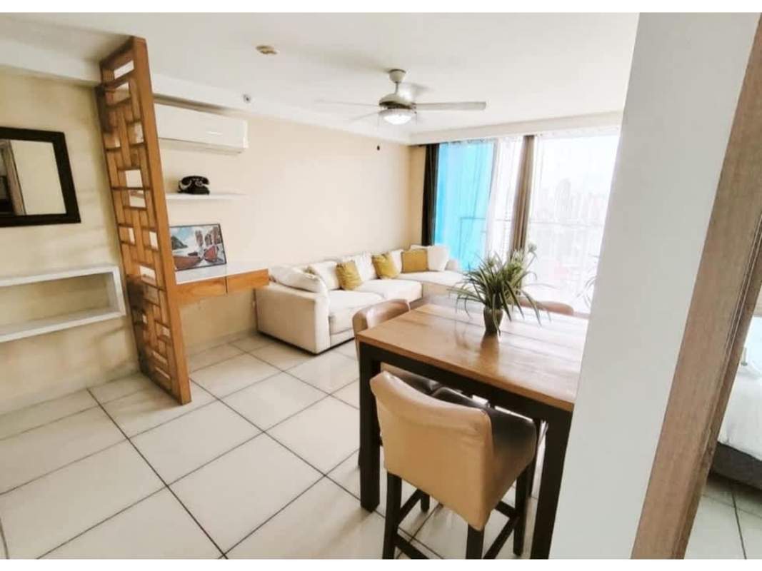 Modern kitchen with granite counters and wood cabinets at PH Torres de Castilla Panama