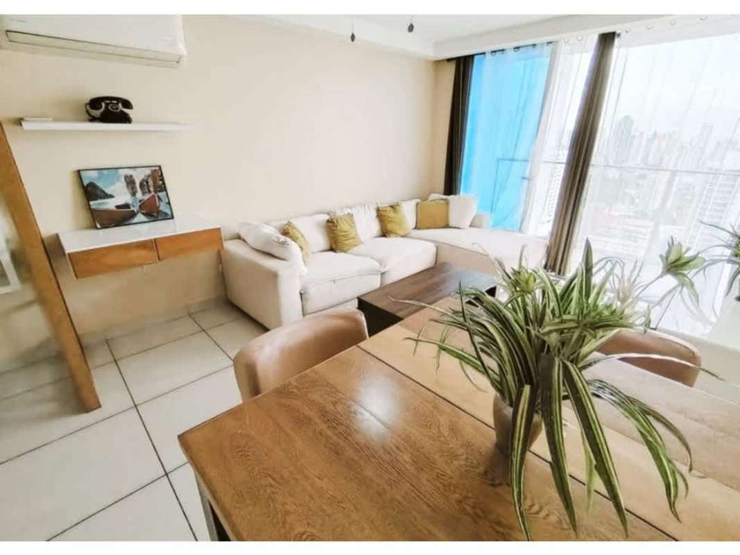 Furnished living room and dining with city views at PH Torres de Castilla Panama
