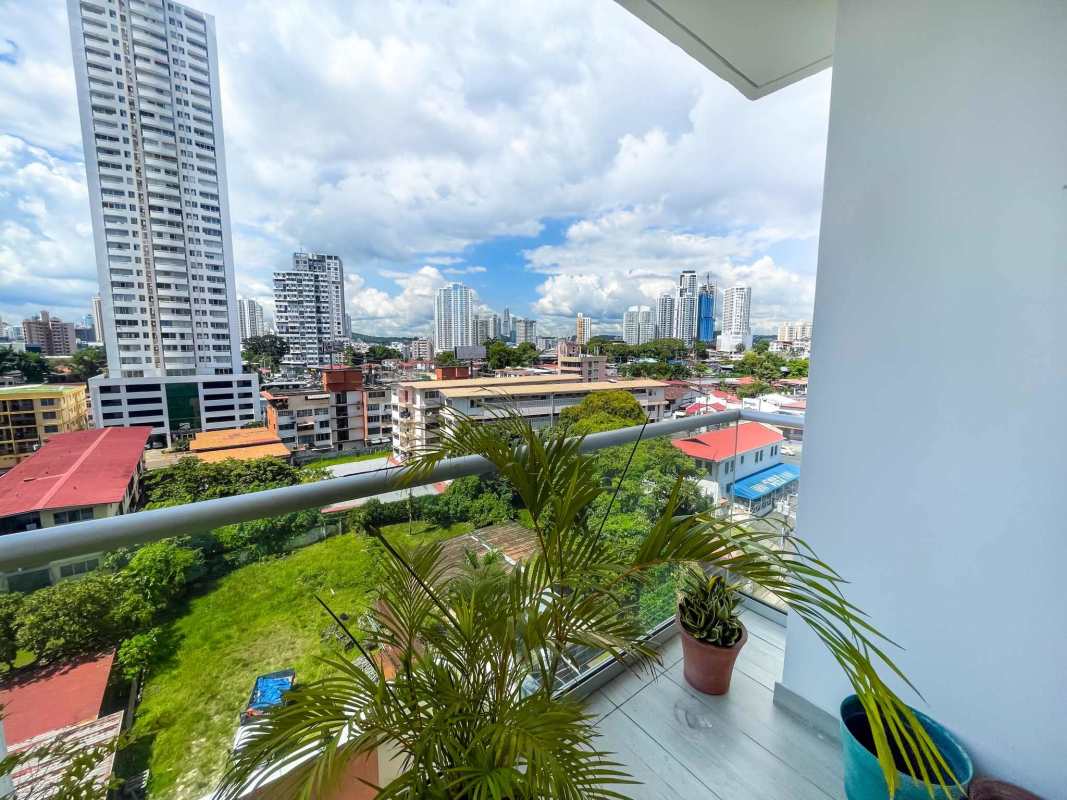 Modern balcony with glass railings and skyline view in PH Windows Tower San Francisco Panama