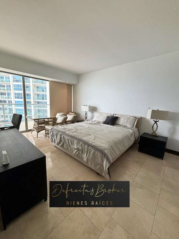 Furnished master bedroom with king bed and ocean views at PH The Ocean Club Punta Pacifica