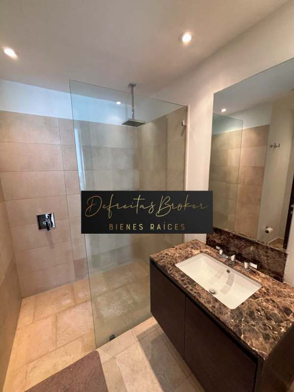 Modern luxury bathroom with marble countertops and glass shower PH The Ocean Club Panama