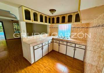 Traditional kitchen with tiled walls, glass-front cabinets, double sink in Villas del Palmar Arraiján Panama