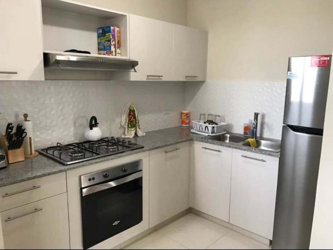 Furnished kitchen granite countertop stove fridge Torres de Versalles Ciudad Radial Panama