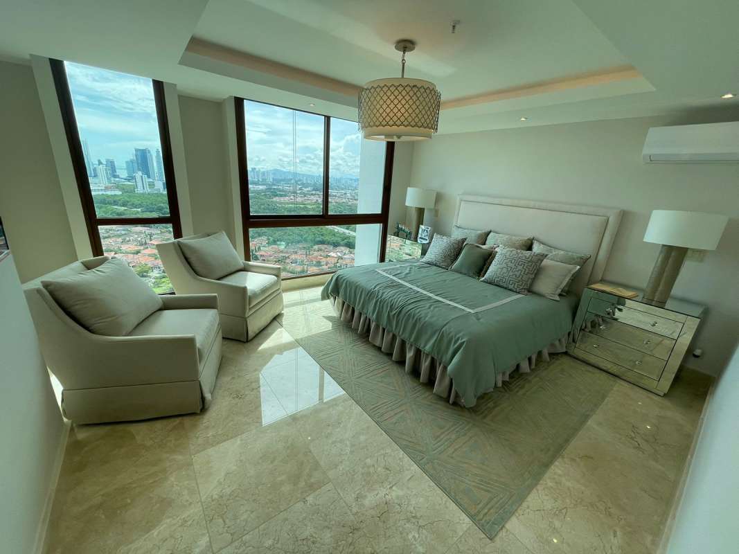 Modern kitchen featuring marble counters, island, stainless appliances in PH Ocean House Santa Maria Panama