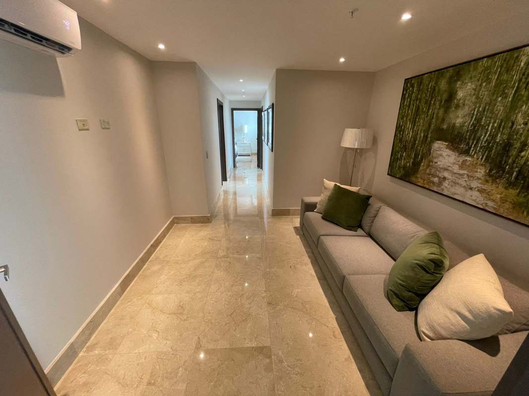 Contemporary master bedroom with large windows and golf course views PH Ocean House Santa Maria Panama