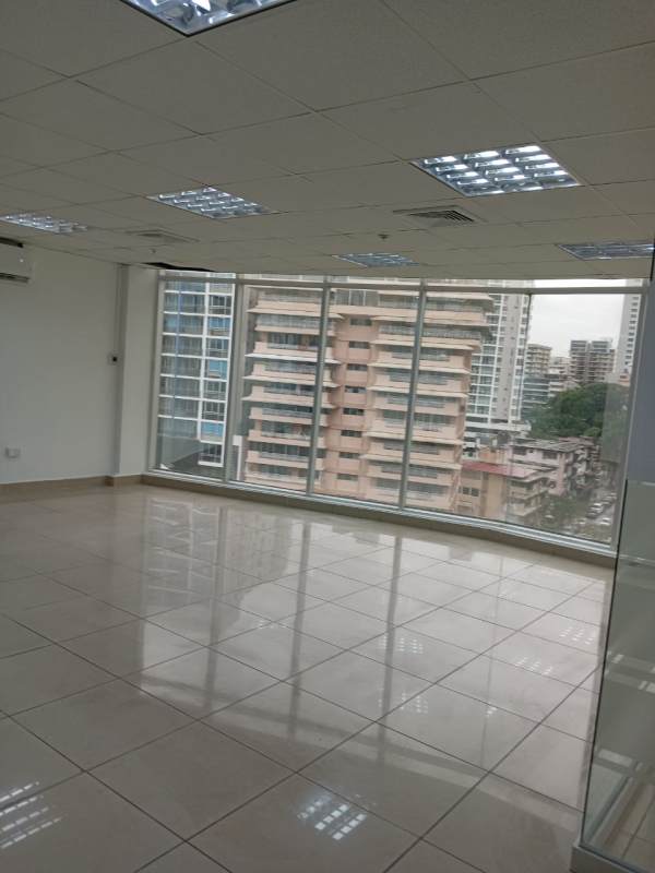 Office area with large windows overlooking Panama City skyline in El Carmen Bella Vista