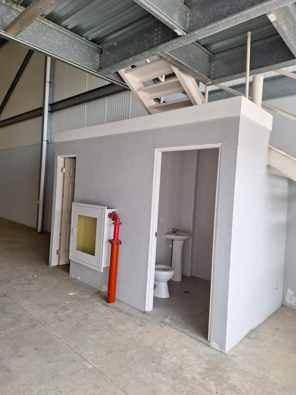 Modern warehouse exterior with loading dock ramp at Panapark Free Zone Tocumen Panama