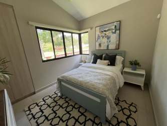 Minimalist bright bedroom with natural light and custom closet Terra Viva Coronado
