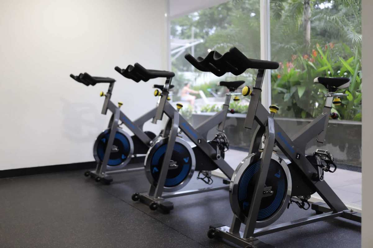 Contemporary kitchen with granite countertops and wood cabinets at PH Hacienda Golf Brisas del Golf Panama City