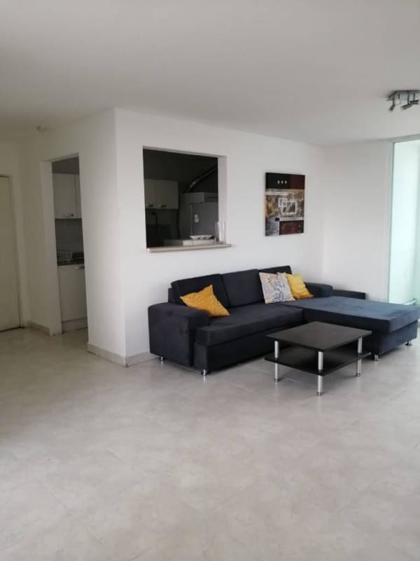 Furnished living room with sectional sofa in PH Majestic Garden Edison Park Panama City