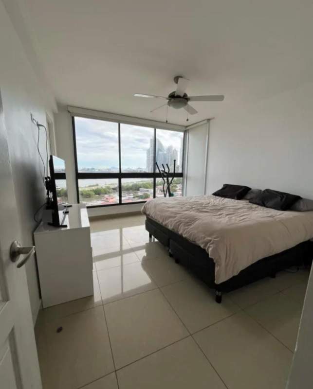 Modern bedroom with large windows, ocean view, ceiling fan in PH San Francisco Bay Coco del Mar Panama