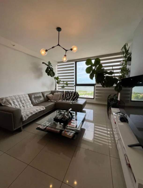 Contemporary living room with large windows, balcony view, sectional sofa in PH San Francisco Bay Panama