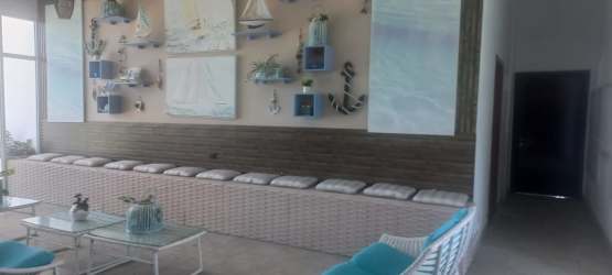 Bright coastal inspired living room with nautical decor at Playa Blanca Resort Panama