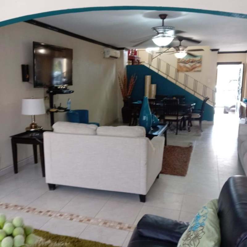 Outdoor swimming pool with safety fence and covered patio Brisas del Golf Panama City