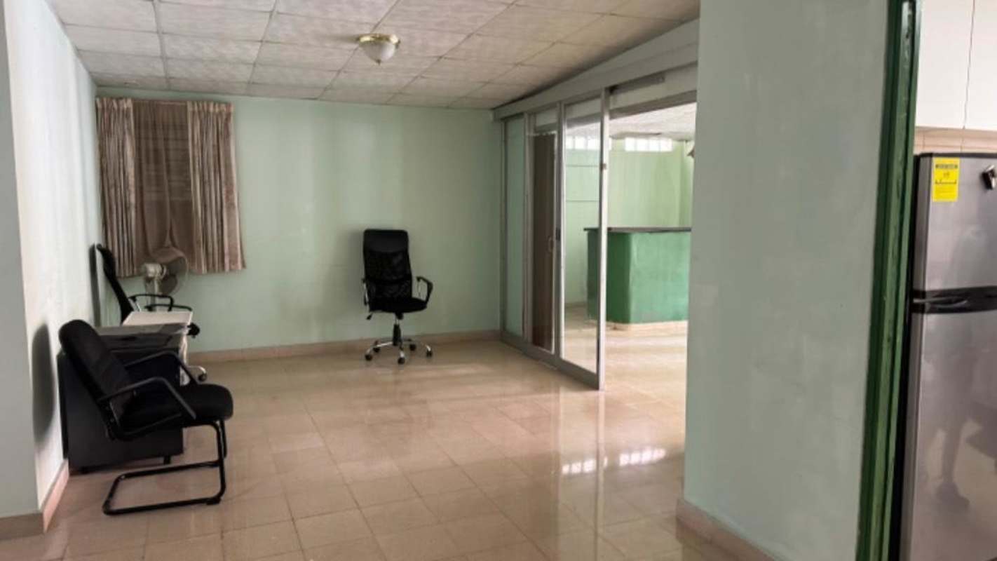 Interior with sliding glass doors, black chairs, tiled floor near El Dorado Mall