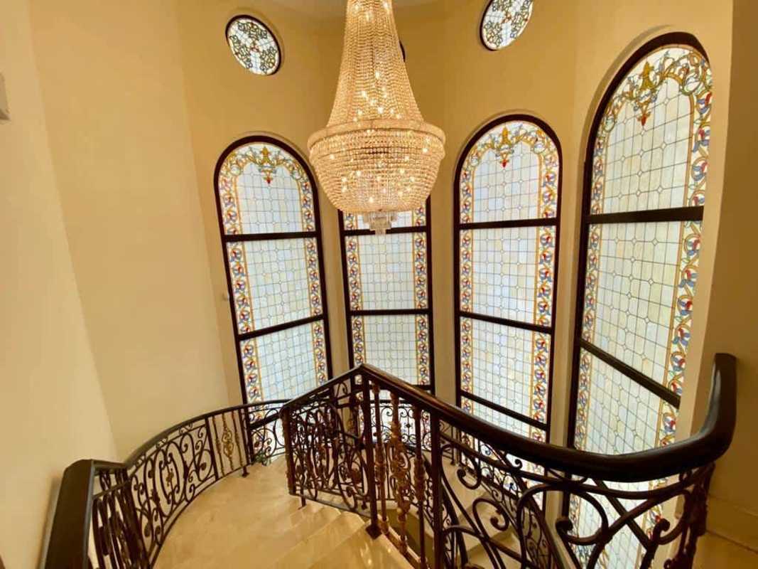 Gourmet kitchen with granite counters, wood cabinets, island Santa Maria mansion Panama