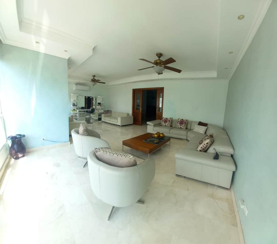 Contemporary living room with marble floors, ceiling fan, sectional cream sofa PH Bahía Esmeralda Panama