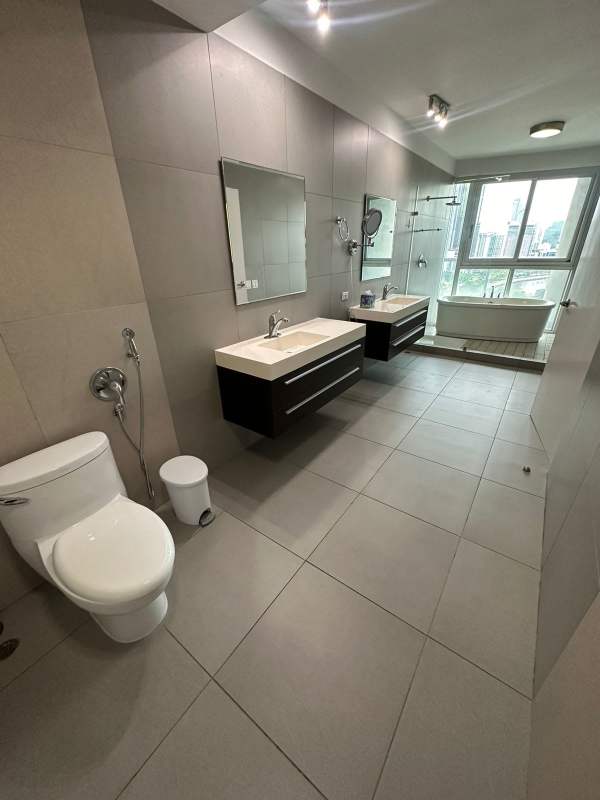 Modern bathroom with freestanding tub large windows ocean skyline views PH BICSA Tower Panama