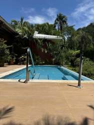 Covered garden terrace with seating area pool view luxury house Chitré Canta Rana Panama for sale