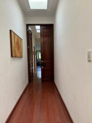 Large living and dining room with vaulted ceilings, wood floors, tropical decor in luxury house Canta Rana Chitré Herrera Panama