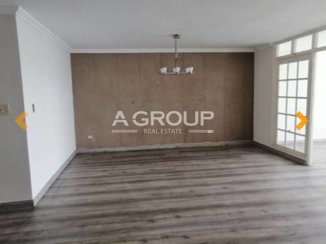 Bedroom with laminate floors, large window, ceiling fan, built-in closet at Torres del Pacífico Marbella Panama