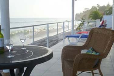 Open living dining area with oceanfront terrace Solymar villa Playa Corona Panama property