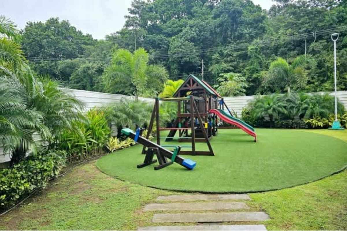 Stylish bathroom with granite countertop, glass enclosed shower and modern fixtures