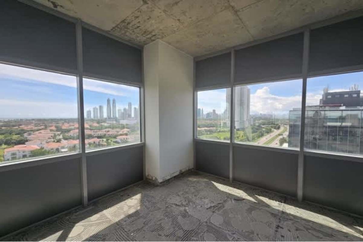 Bright shell space unfinished interior floor-to-ceiling windows Santa María Business District