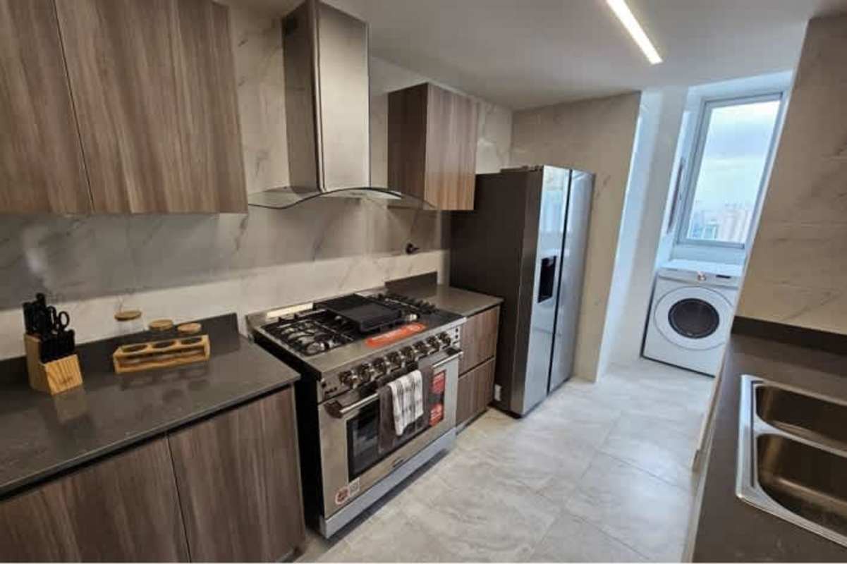 Modern kitchen with stone countertops, stainless steel appliances at PH Vista Hermosa Tower