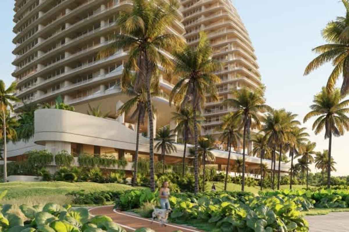 Luxury twin high-rise Ipanema Residences with curved balconies and tropical landscaping