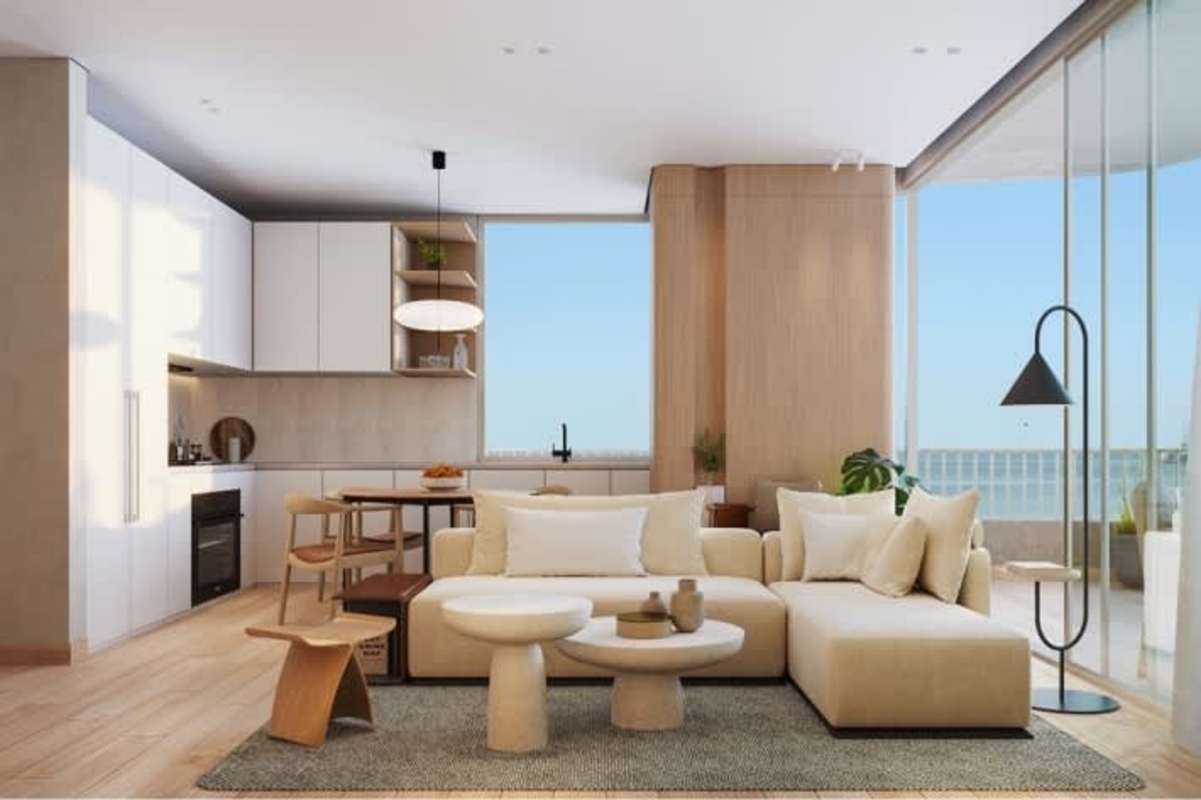 Bedroom with floor-to-ceiling glass doors to oceanfront balcony, light wood finishes and sea views