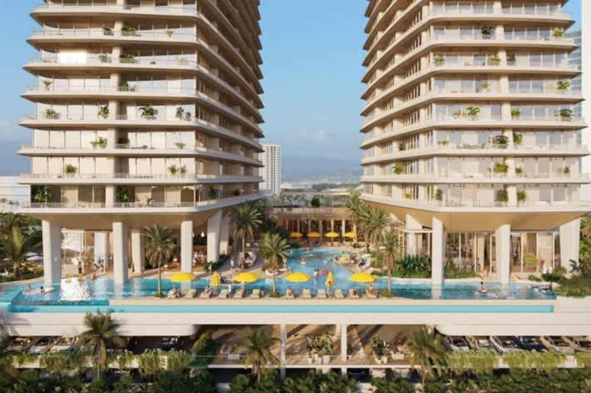 Infinity pool, lounge area, tropical gardens with luxury skyscrapers of Ipanema behind