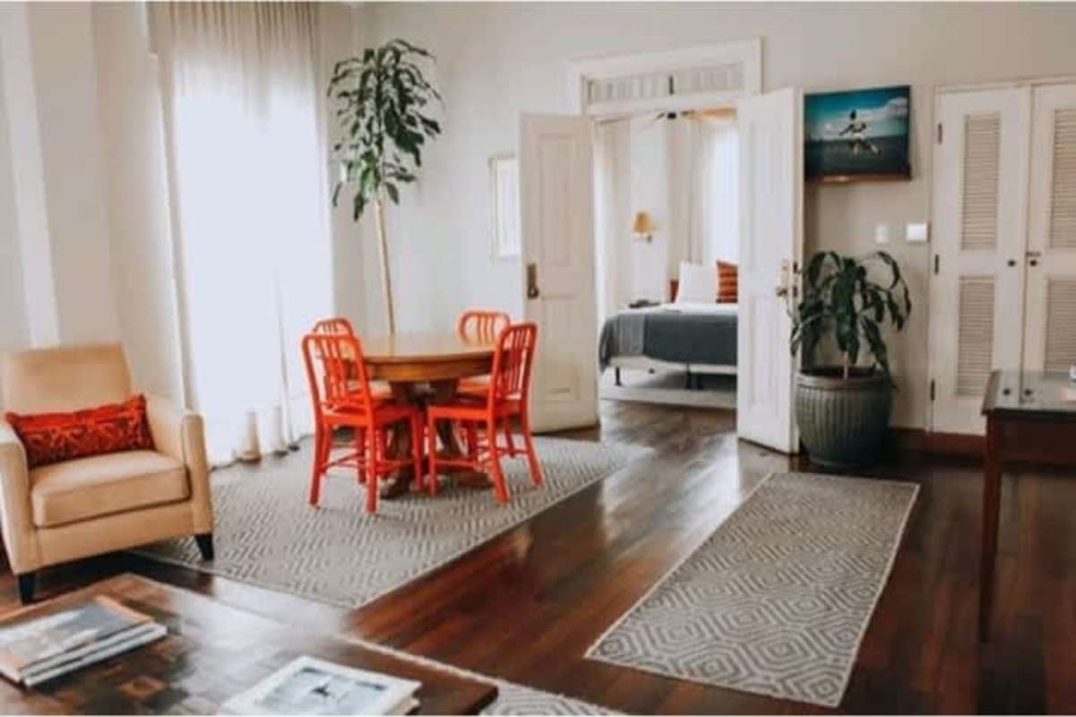 Modern open plan living dining with colonial decor bright windows Las Clementinas Casco Viejo Panama