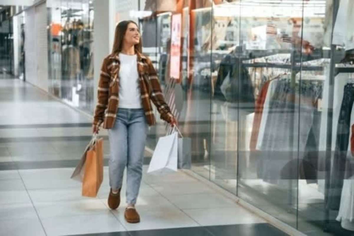 Wide mall corridor with retail shops and pedestrian traffic in Costa del Este plaza Panama City