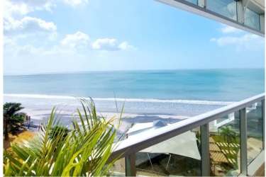 Bright open layout living room with elegant kitchen and ocean views in PH Playa Malibu Nueva Gorgona Panama