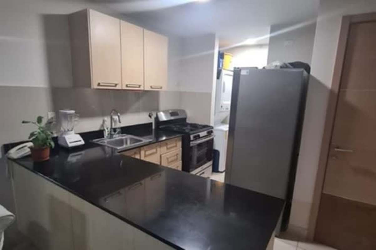 Simple bedroom setup with AC, tiled floor and wall shelf in PH Vía España San Francisco