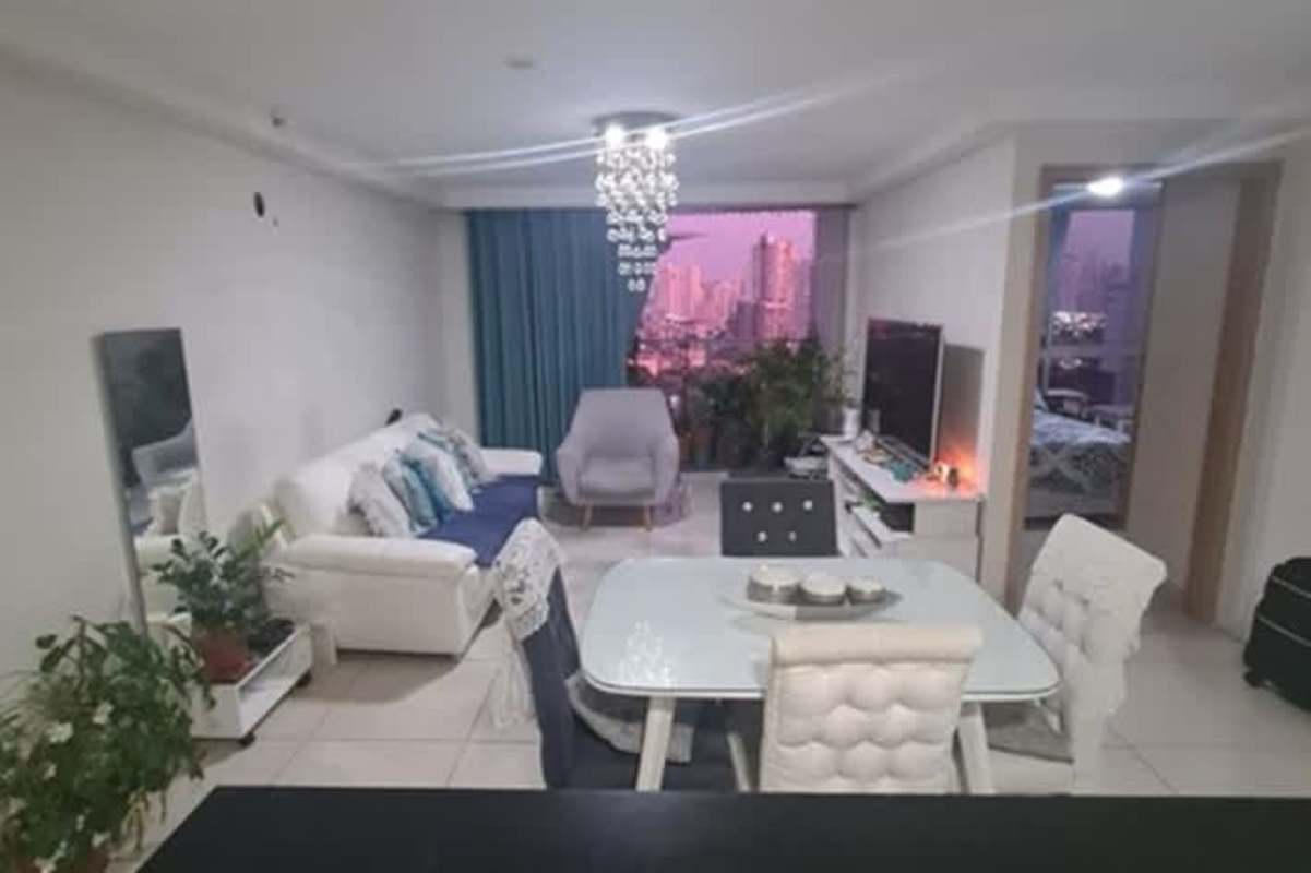 Equipped modern kitchen with granite counters, gas stove, and laundry space in PH Vía España Panama City