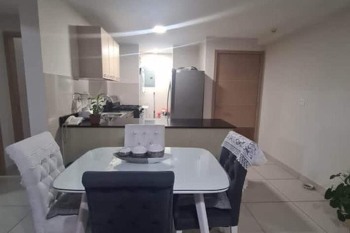 Modern open plan kitchen and dining area with granite counters in PH Vía España Panama